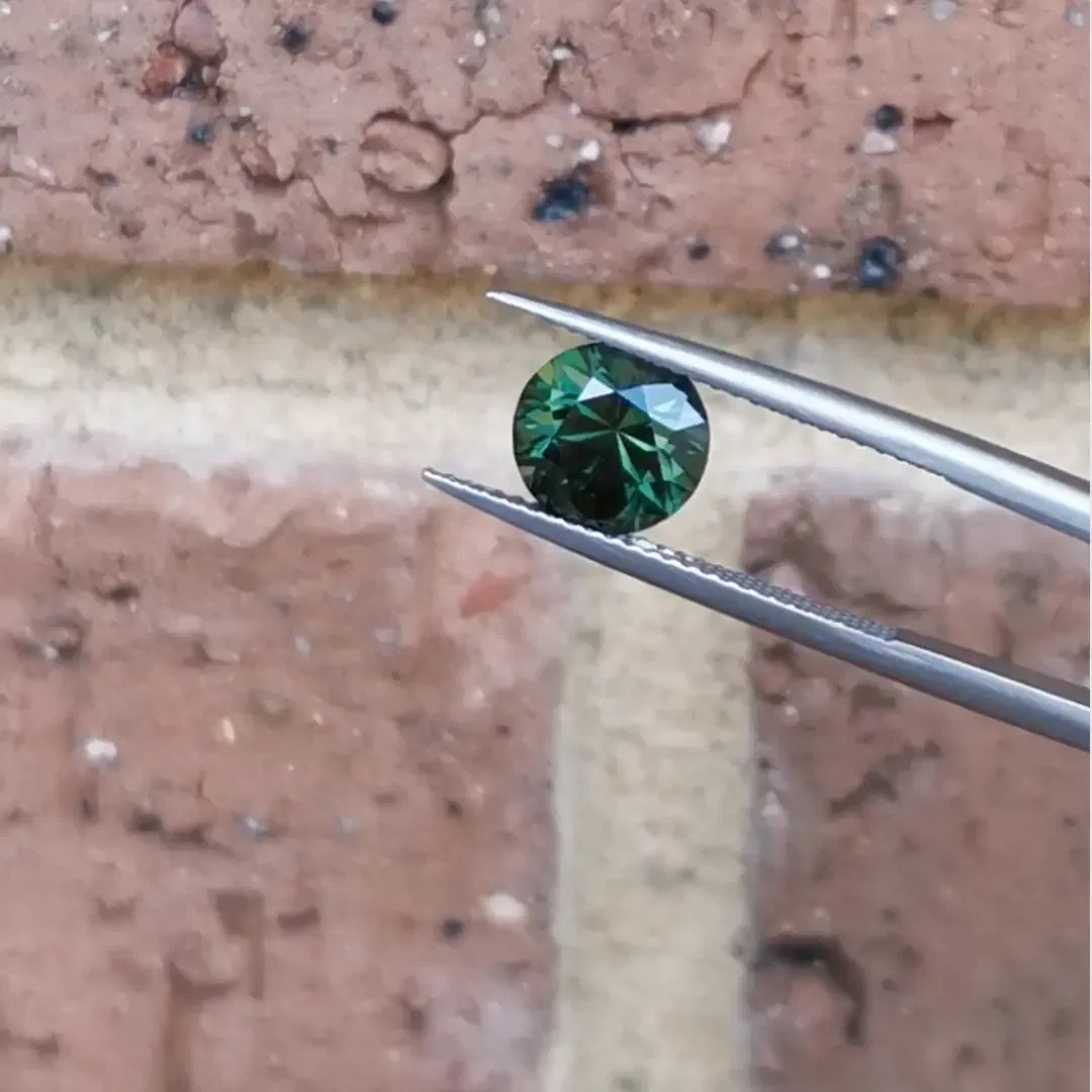 a close up of the emerald and diamond ring